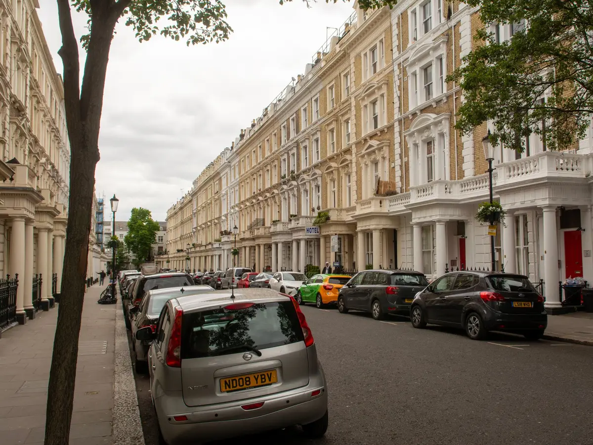 Tall Victorian terraces along a London street