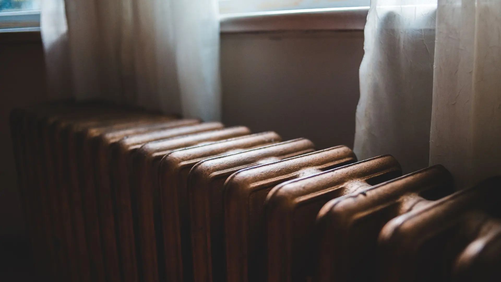 Cast iron column radiator in window light